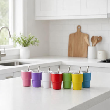 Babycino cup designed for small hands, featuring insulation and a stainless steel straw.